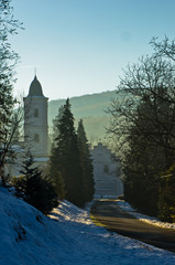 Road to monastery Beocin covered with snow at sunny winter morning, near Novi Sad, Serbia