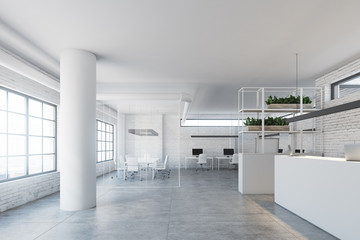 White brick wall office, white reception desk side