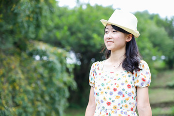 a portrait of beautiful woman in the park