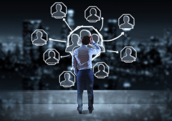 Businessman watching social network sketch on a rooftop 3D rendering