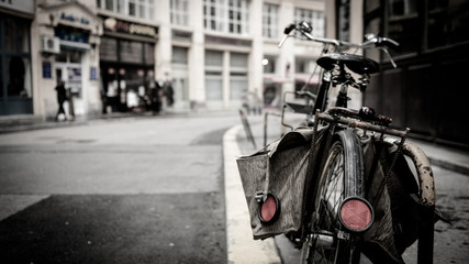 Fototapeta na wymiar Overcast urban streetcar with bicycle. The sun does not shine, gray, sad is the world.