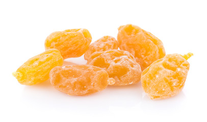 Dry yellow plums on white background