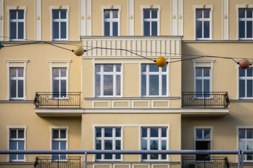 Fototapeta na wymiar Yellow facades of old historical tenement houses