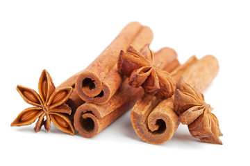 Cinnamon sticks and star anise isolated on white background. Christmas spices.
