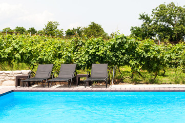 Beach chairs near swimming pool