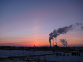 sunset with smoke from factory
