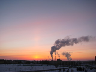 sunset with smoke from factory