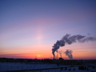 sunset with smoke from factory