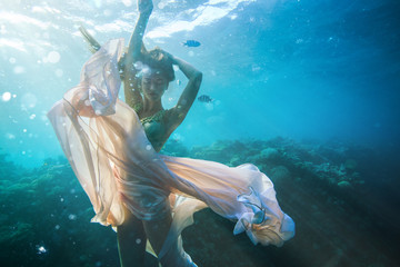 Beautiful fashion model underwater