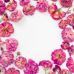 Fototapeta na wymiar Floral round frame made of pink roses on white background, Flat lay, Top view