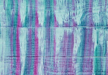 Pink, white, blue and purple streaks on wood background