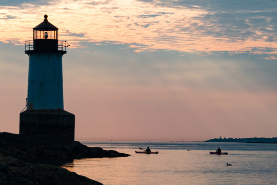 Men Canoeing near Salem Lighthouse at Dawn