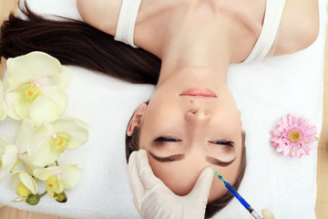 Obraz na płótnie Canvas Beauty Care. Woman's Face Receiving Skin Lifting Injections