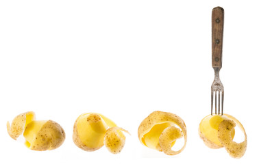 a fresh raw potatoes on a white background