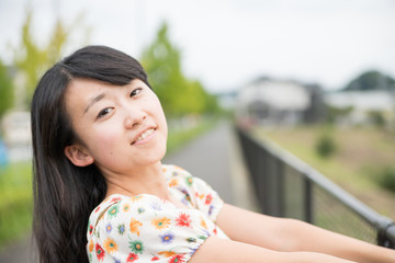 a portrait of beautiful woman in the park