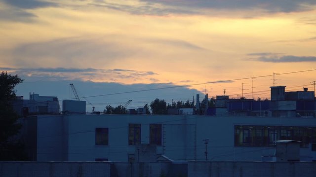 Time-lapse panorama of the city in the evening. Footage shot with 4K RAW sequence photo.