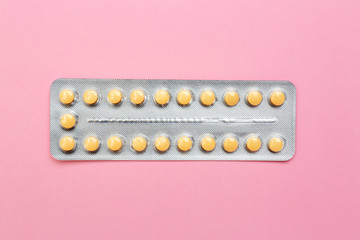 Blister with contraceptive pills on color background