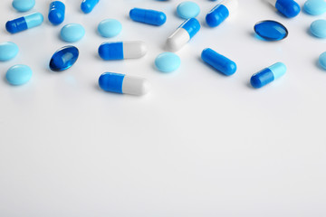 Blue pills on white background