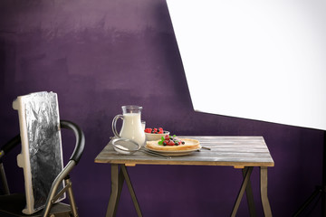 Photo studio with professional lighting equipment during shooting food