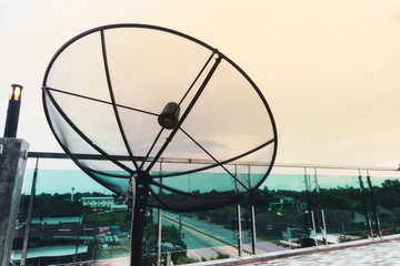 satellite dish on sunset blue sky.