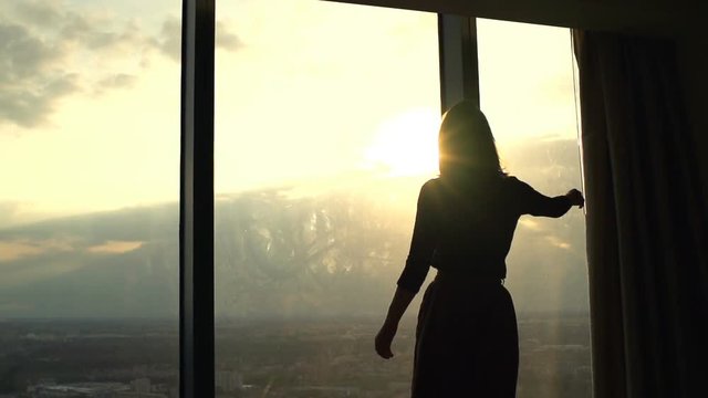 Woman veil curtain, covering window at home, super slow motion 120fps
