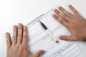 Fototapeta premium human hand and the form of the document application for employment