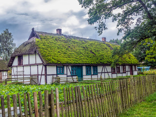 Fototapeta na wymiar Old wooden farmstead in Kluki, Poland