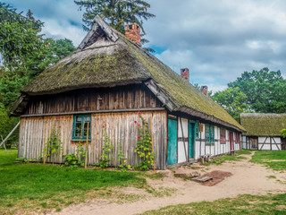 Fototapeta na wymiar Old wooden farmstead in Kluki, Poland