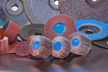 Flap Wheel. A pile of color abrasive sandpaper for metal working - obrazy, fototapety, plakaty