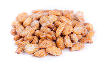 Pile of sweet roasted peanuts isolated on a white background