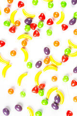 Background of fruit shaped candies isolated on a white background