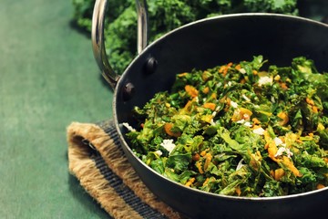 Kale leaves stir fried with Turmeric and coconut, selective focus