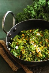 Kale leaves stir fried with Turmeric and coconut, selective focus