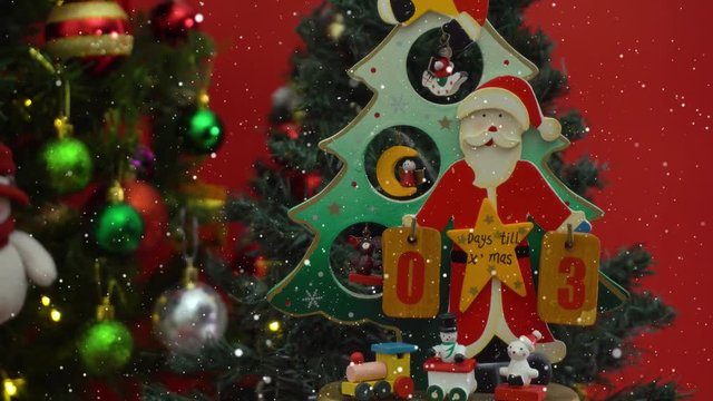 Greeting Season concept.Dolly of Santa Claus show 3 days till Xmas with ornaments on a Christmas tree with decorative light in 4k (UHD)