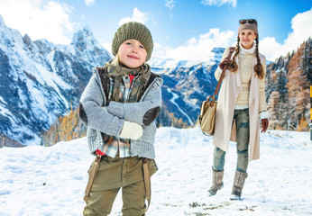 mother and daughter tourists against mountain landscape