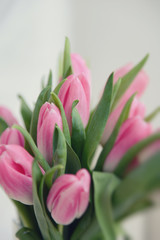 a bouquet of pink tulips in a vase
