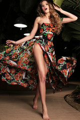 beautiful girl with blond hair in swimsuit posing at summer beach