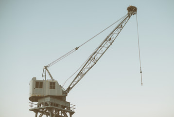 Port crane with a stork's nest on it.