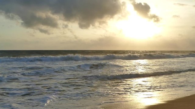Ocean waves on the sunset tima. Slow-motion
