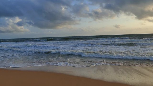Ocean waves on the sunset tima. Slow-motion