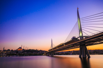Long exposure aesthetic view of Halic Metro Bridge during the twilight