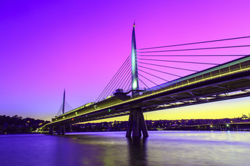 Long exposure aesthetic view of Halic Metro Bridge during the twilight