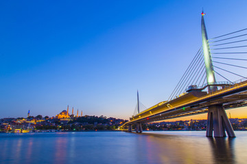 Fototapeta na wymiar Long exposure aesthetic view of Halic Metro Bridge during the twilight
