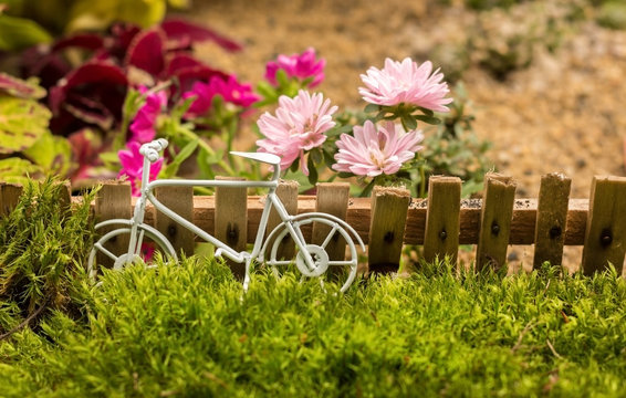 small bike miniature summer composition with flowers
