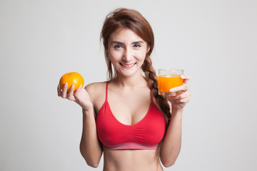 Beautiful Asian healthy girl with orange juice and orange fruit.