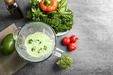 Creamy avocado sauce for fish taco in blender on kitchen table