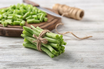 Bunch of fresh green beans on wooden table