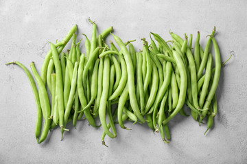 Fresh green beans on light background