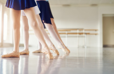 Legs of girls in pointe practicing in ballet