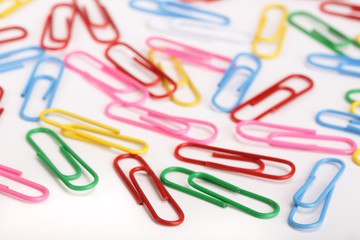 colorful paper clips isolated on white background